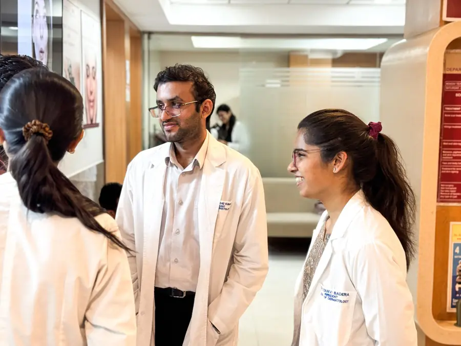 Dermatology residents talking in the outpatient department corridor