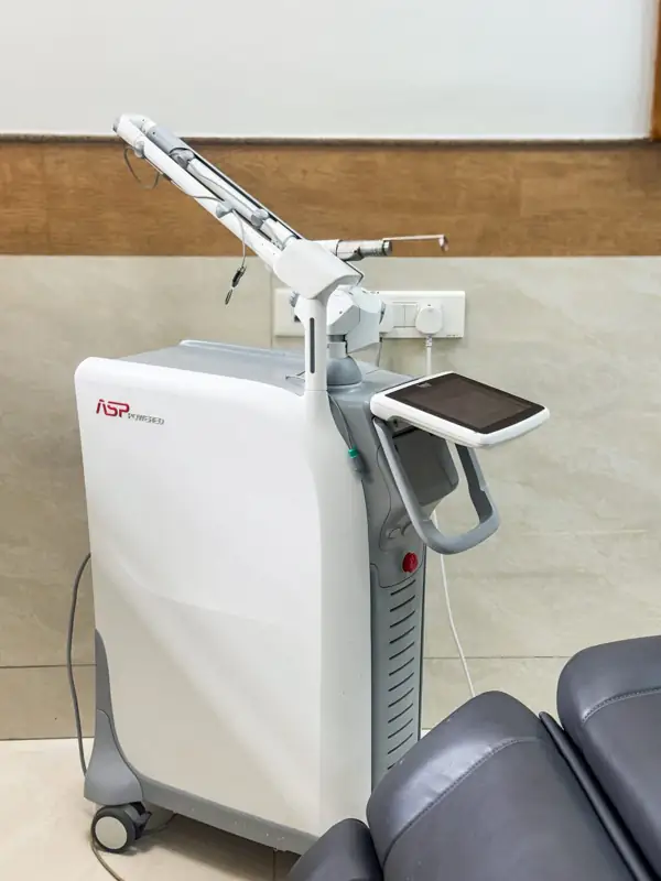 Fotona StarWalker MaQX laser beside a treatment chair